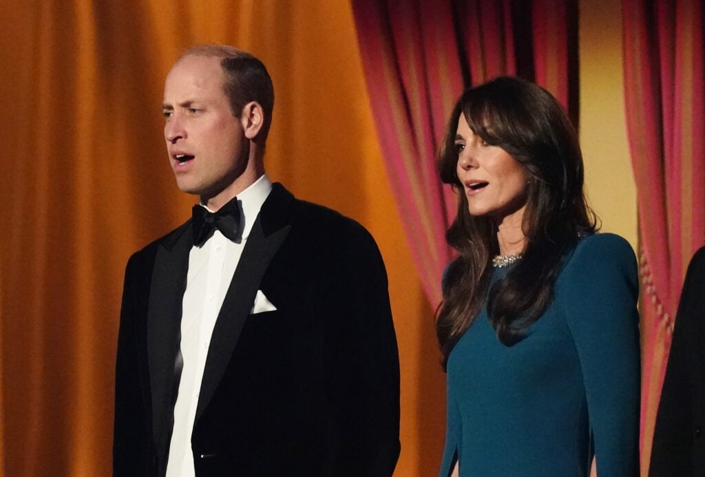 Prince William, Prince of Wales and Catherine, Princess of Wales sing the national anthem during the Royal Variety Performance before the Royal Variety Performance at the Royal Albert Hall on November 30, 2023 in London, England.