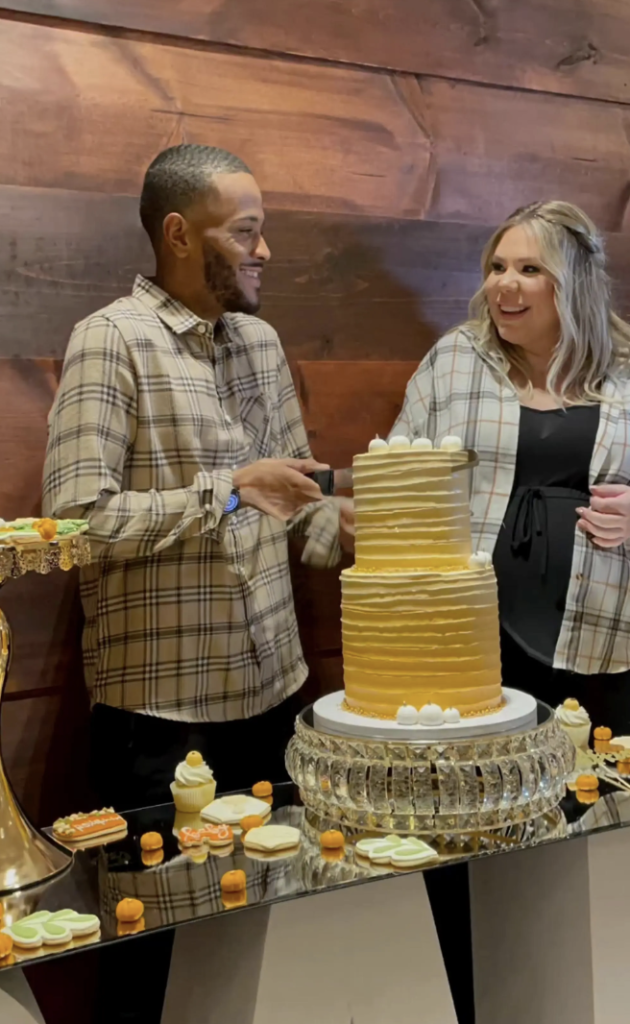 Kailyn Lowry converses with boyfriend Elijah Scott at a gender reveal party