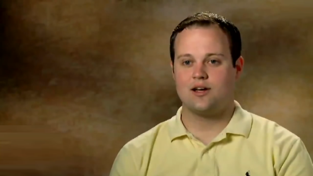 Josh Duggar in an ugly yellow polo shirt on 19 Kids and Counting.
