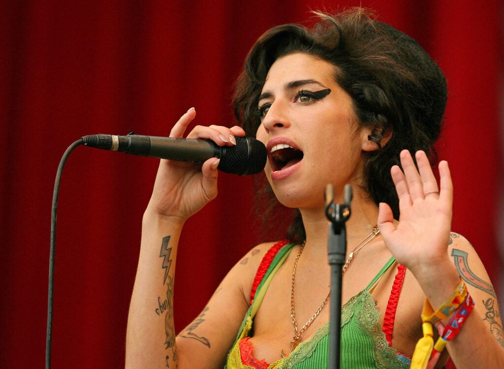 Amy Winehouse performs at the Glastonbury music festival, in Pilton, Somerset, in south-west England, 22 June 2007.   